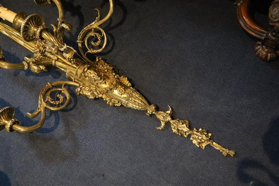 A pair of late Victorian ornate cast brass five branch wall lights, width 22in. depth 11in. height 39in.